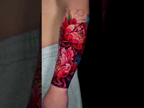 Red peony tattoo on the forearm, color realism by Qneedle