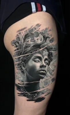 Black and grey Egyptian mythology full sleeve tattoo featuring Anubis and ancient Egyptian imagery.